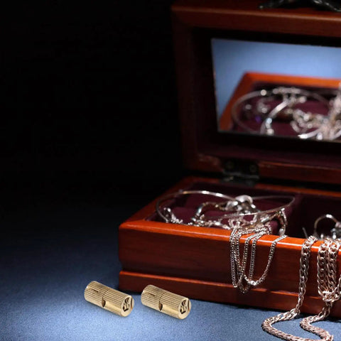 Solid Brass Hidden Hinges For Cabinets And Jewelry Boxes near wooden jewelry box with open lid showcasing chains inside