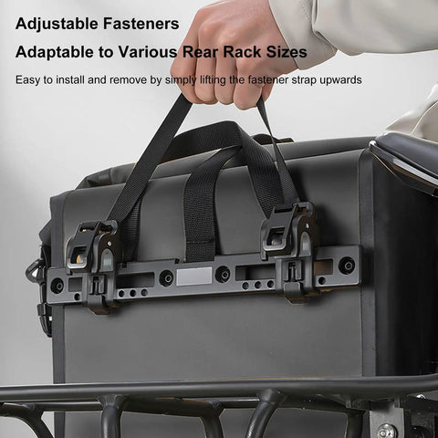 Close-up of rainproof bike rack pannier bag with reflective strips and buckle, adjustable straps on rear rack for stable ride.