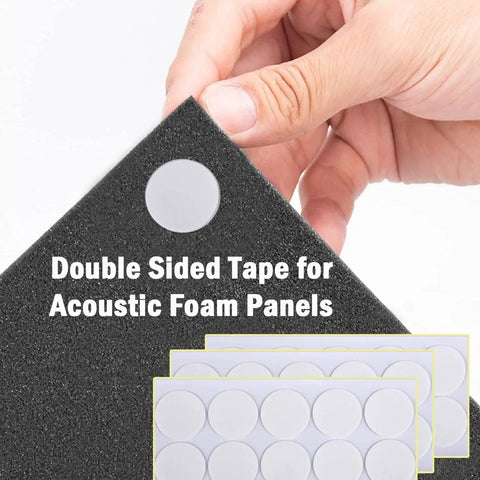 Close-up of hand holding black acoustic foam panel with double sided tape, part of Twelve Pack High Density Pyramid Acoustic Foam Wall Panels With Strong Self Adhesive Backing Sound Proof Tile Blocks Chatter Zero Echo Tight Home Recording Setup.