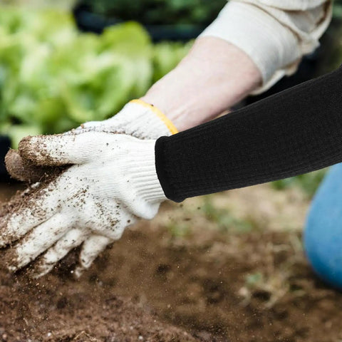 Dang Tough Cut Resistant Arm Sleeves For Gardeners And Carpenters With Elastic Wrist Guard Heat Resistant Safety Gear keeping forearm protected while digging in soil.