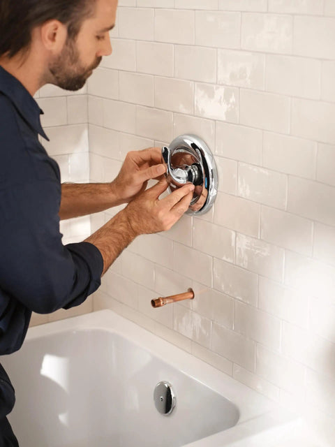 Man installing PosiTemp Rough In Pressure Balancing Shower Valve For Half Inch CC Connection Behind Wall Install A DIY Upgrade