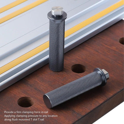 Two Pack Nineteen Millimeter Aluminum Clamp Tenons for Woodworking Tables shown on wood surface and metal rail