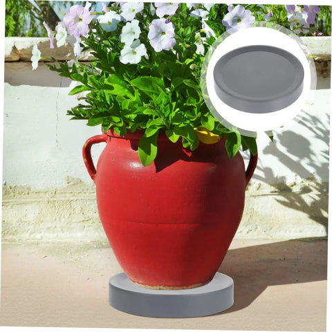Heavy Duty Pot Trolley With Four Smooth Swivel Wheels Crafted as a No Sweat Garden Mover and Hella Tough Planter Cart for Large Flower Pots Indoors or Outdoors under a red flower pot with white flowers.