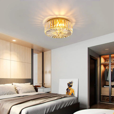 Bedroom with Four Light Crystal Drum Ceiling Light Fixture With Gold Brass Finish, illuminating with luxe modern glow.