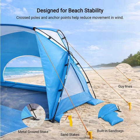 Portable Beach Sun Shelter For Families And Groups with sand stakes, guy lines, and metal ground stake at a beach.