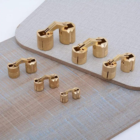 Top Shelf Solid Brass Hidden Barrel Hinges With A Dead Nuts Concealed Fit And Heavy Duty Smooth Swing For Easy Install On Woodworking Craft Jewelry Boxes Pack Of Four, displayed from above.