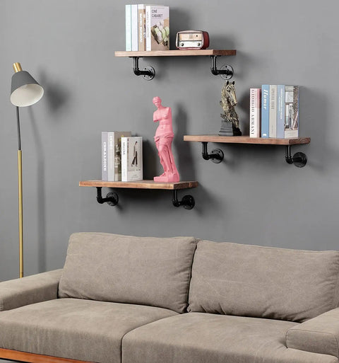 Beefy Wall Hanging Shelf Brackets Set Of 6 Heavy Duty Rustic Black Metal Pipe Brackets For DIY Open Shelving Floating Shelves Supports Farmhouse Home Decor in living room with books and statues displayed.