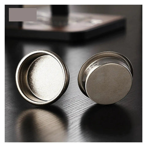 Premium Titanium Portafilter Basket 58.5mm Holds 18 To 20 Grams with shiny surface and perforated bottom for brewing.