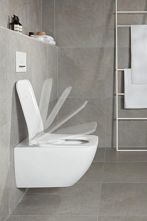 Solid Setup Rectangular Toilet Seat With Slick Soft Close Hinges And Easy Care Duroplast Frame Original Quality Bathroom Essentials Heavy Duty Replacement Lid Stone White in a modern bathroom setting.