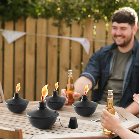 4 Pack Metal Tabletop Torches 22oz Citronella Scented Outdoor Torches For Patio Deck And Garden on wooden table with people
