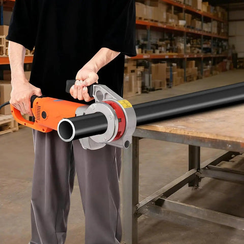 User operating the Built Tough Portable Pipe Threader Driven By 2300 Watt Copper Motor and Six Grip Tight Dies on a black pipe.