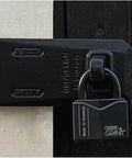 Granit Plus 14 Mm Hardened Steel Open Shackle Padlock on a door, showing rustproof alloy body and cataphoretic coating.