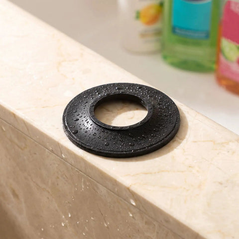 Close-up of a 10pcs Bathtub Drain Stopper Gasket Rubber Washer for Pop up Tub on a wet marble surface.