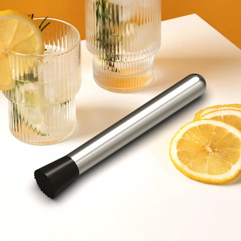 8 Inch Stainless Steel Cocktail Muddler For Mojitos And Fruit Drinks Heavy Duty Bar Tool For Home Bar And Kitchen Lemon Smasher Easy To Clean Pro Grade Ice Crusher Bartender Accessories on a table with lemon slices