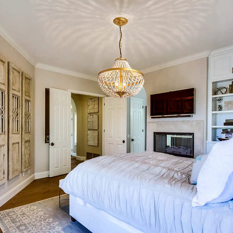 Three Light Boho Wood Beaded Gold Chandelier in a cozy bedroom setting, rustic farmhouse pendant light fixture