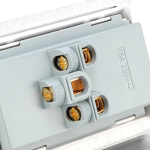 Close-up of recessed floor electrical outlet kit with smooth pull down lid, featuring heavy-duty gray connection terminals.