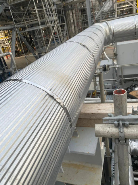 Industrial pipe secured with Five Eighths Inch Wide 304 Stainless Steel Band By Three Hundredths Inch Thick One Hundred Feet Long Heavy Duty