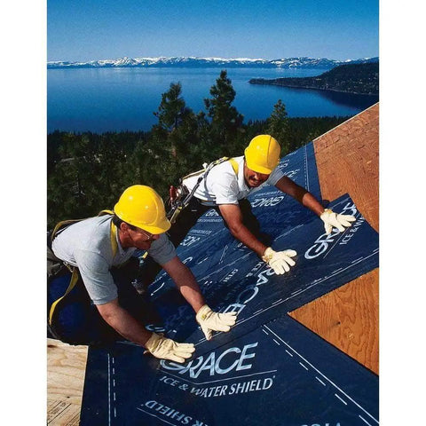 Two workers installing Gotta Have This Top Grade Ice And Water Shield Roofing Underlayment Self Adhered Membrane on a roof.