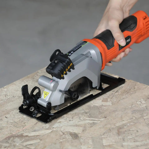Heavy Duty Mini Circular Saw With Beefy 4 Amp Motor And Crisp Laser Sight For Dang Clean Cuts On PVC Laminate Drywall And 2x4s Featuring Slick Dust Collection Port on a wooden surface.
