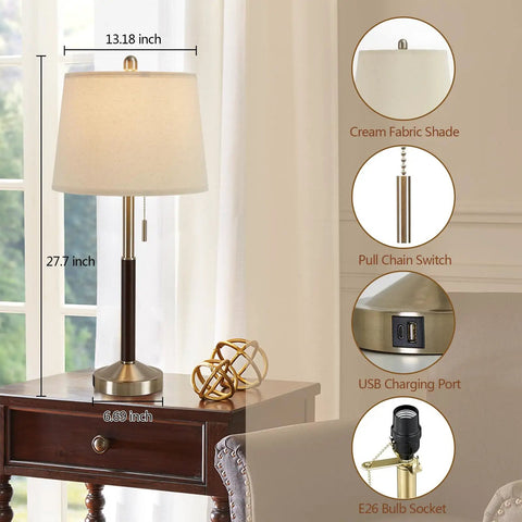 Lamp with cream shade and pull chain on brown wood stand with USB port on nightstand.