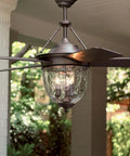 Close-up of Knightsbridge Collection 52-Inch Indoor Outdoor Ceiling Fan with bronze ABS blades and ripple glass light kit.