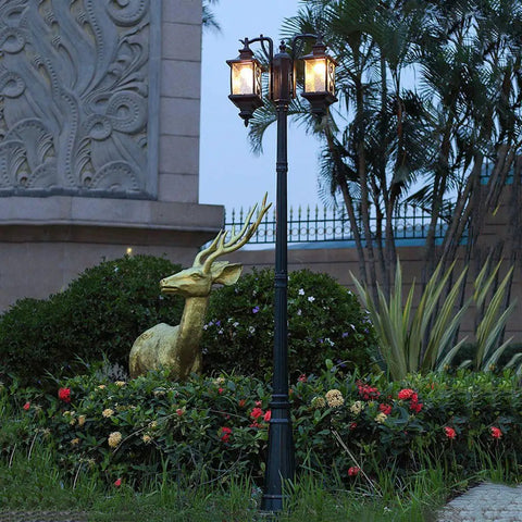 Top Shelf Dual Head Outdoor Led Street Light With Slick Water Wave Glass And Heavy Duty Aluminum Pole in garden setting.