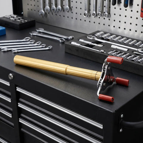 Ladder Free Smoke Transducer Assembly Tool With Heavy Hitter Sensor Head For High Ceiling Detectors on a workbench with wrenches.