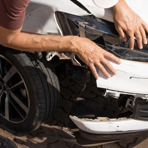 Heavy Duty Auto Dent Puller Kit includes nine nylon threaded rod tips used for fixing hail damage and door dings on a car bumper.