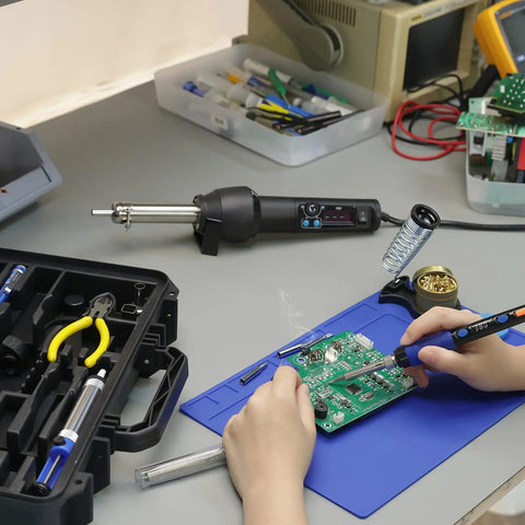 Person using All In One Portable Soldering And Hot Air Rework Kit With PID Temperature Control 65W Soldering Iron on circuit board