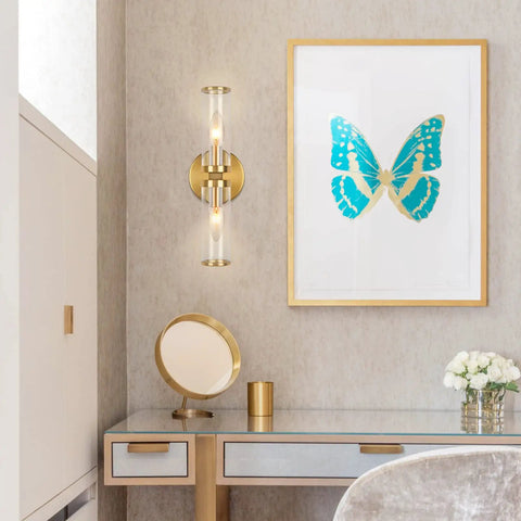 Gold Wall Sconce Lights Two Pack With Candle Shaped Glass Shades in modern room with blue butterfly art.