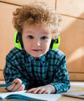 Child wearing Four Pack Kids Ear Protection Earmuffs Adjustable Noise Reduction 27NRR Noise Cancelling Earmuffs For Sleep And Study