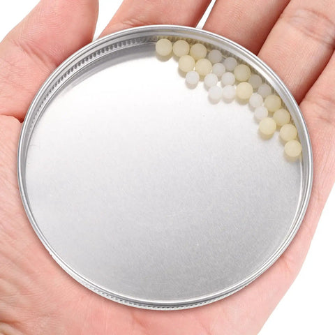Heavy Duty Solid Nylon Bearing Balls With Smooth As Silk Rotation And Top Shelf Alkali Resistance For Precision Mini Mechanical Projects and Low Friction Gear Repair Kits in a hand.