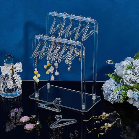 Super Sleek Acrylic Earring Holder Stand With Twenty Mini Hangers Holds Up To Sixty Pairs Two Tier Jewelry Organizer showcases earrings neatly.