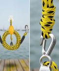 Stainless Steel Bungee Dock Line With Pulley featuring yellow and green coiled rope design, stainless hardware for marine use.