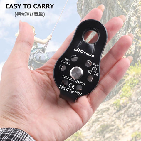 Built Tough Climbing Pulley With Fixed Plate Anodized Aluminum Alloy Sheave For Heavy Duty Rescue Climbing Hauling Zipline Rigging And Rappelling 26KN Max Load Compact Badass Gear Black held in hand.