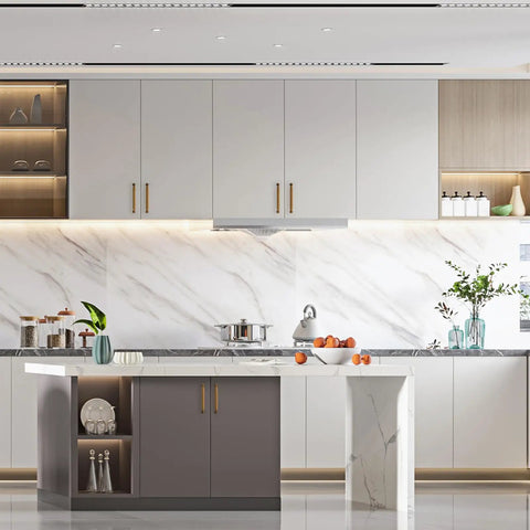 Modern kitchen with marble countertops, featuring Ten Pack 5 Inch 128mm Antique Brass Cabinet Handles for Kitchen Cupboards and Drawers.