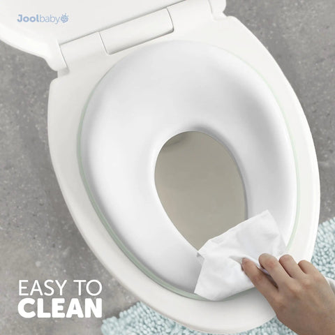 No Sweat Toddler Potty Training Seat Built For Smooth Transitions To The Family Toilet With Sure Grip Non Slip Base And Reliable Splash Shield Included, shown being cleaned.