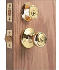 Tylo Entry Knob And Single Cylinder Deadbolt Combo 1 Pack in Satin Nickel installed on a wooden door, showing exterior view