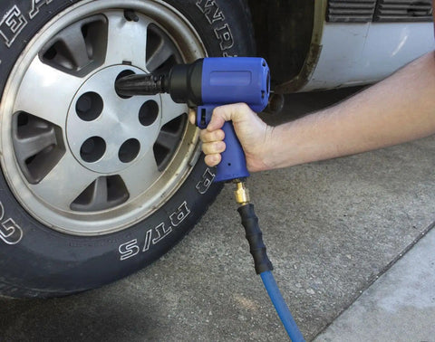 Using Lightweight Half Inch 100 Foot Rubber Air Hose With 300 PSI to power impact wrench on tire