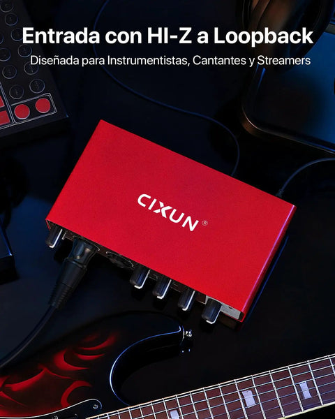 2x2 USB C Audio Interface For PC And Mac, Plug And Play, 24 Bit 192kHz Recording, Dual TS XLR Inputs, 48V Phantom Power, Matte Red Metal Shell on dark background, connected to guitar.