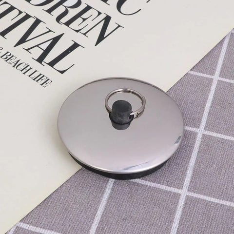 2pcs Rubber Bathtub Drain Stopper for Kitchen and Laundry Use, round metallic surface with black rubber grip, perfect for blocking drains.