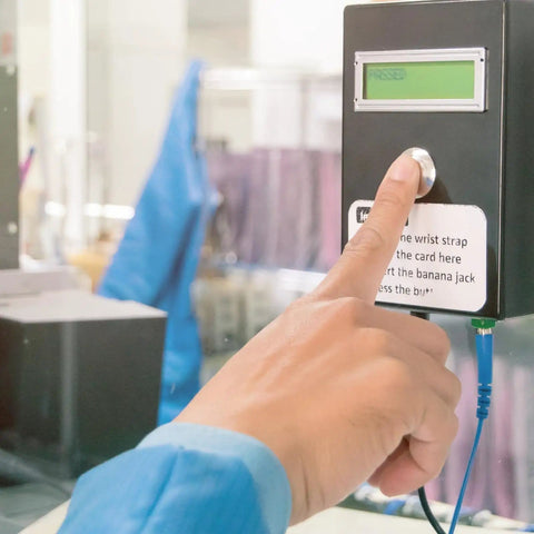 Person testing anti-static wrist strap at ESD safe station, related to 10 Pack Anti Static Wrist Straps Blue 7.9 Inch Perimeter With Alligator Clip