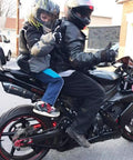 Child on motorcycle using Kids Motorcycle Harness With Two Handles, Adjustable Belt, Breathable Black Material, Anti Slip Grip