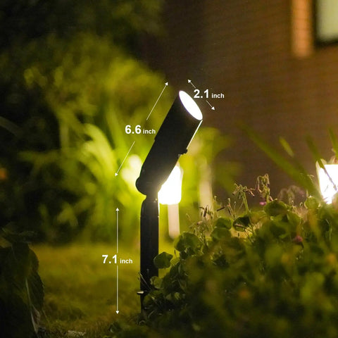 Low Voltage Landscape Spotlight Kit 8 Pack, 20W Halogen Outdoor Lights illuminating garden area, metal stake visible