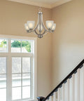 Farmhouse 24 Inch Five Light Chandelier With Clear Glass Shades, Adjustable Chain, Smoked Birch Finish in entryway setting