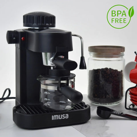 Straight Up Home Barista Vibes With This Compact 4 Cup Electric Espresso And Cappuccino Maker Featuring A Durable Milk Frothing Pitcher For Quick Daily Grind Sessions, black machine with glass pitcher on counter.