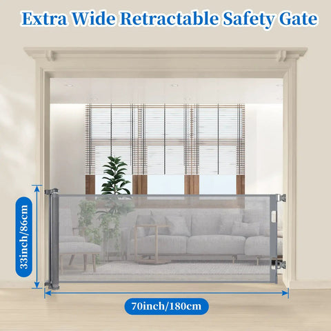 70 Inch Wide Retractable Baby Gate With 33 Inch Height installed in doorway with couch visible in background
