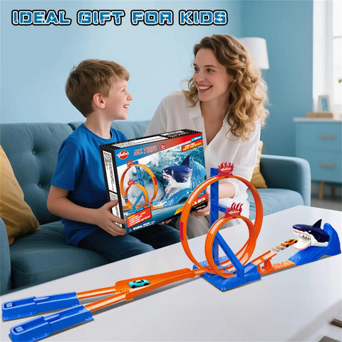 Child receiving Shark Themed Car Race Track Set With Dual Loop And 2 Cars And Launchers, playset on table