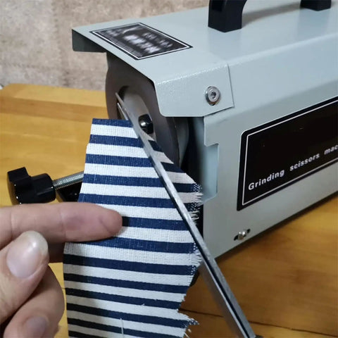 Professional Grade 220W Electric Scissors Sharpener That Crushes Dull Blades And Delivers Razor Sharp Results For Tailors And Seamstress Pros Seeking A Steady Workhorse To Keep Their Tools Sickly Sharp Daily with fabric cutting in progress.