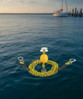 Marine Tow Line With Pulley And Buoyant Bungee Dock Rope For Boats, yellow and black, floating on water near dock